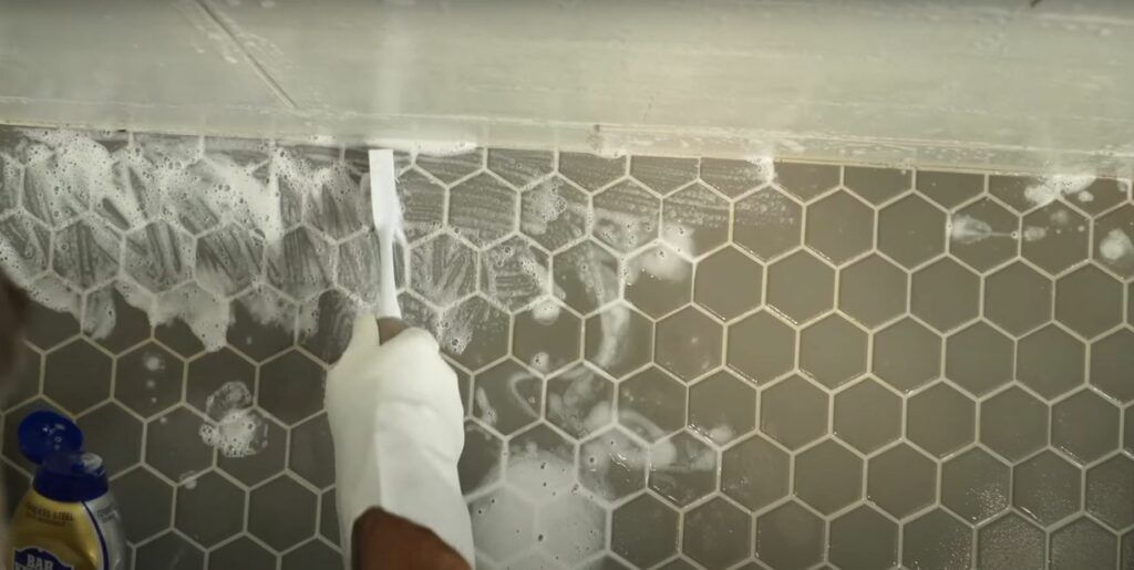 scrubbing bathroom floor tiles